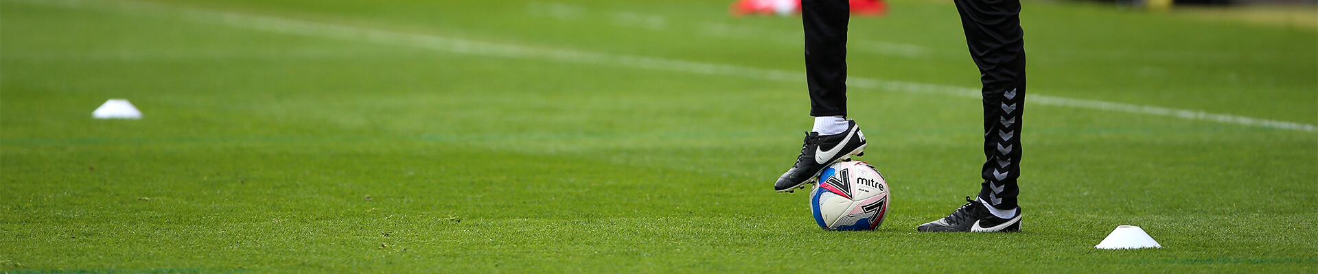 Player standing on a ball