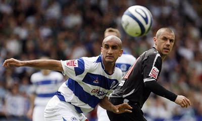 Kevin Phillips (right) vies for the ball with Zesh Rehman