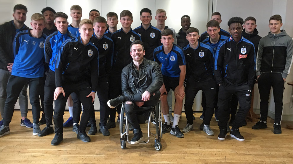 Peter Mitchell with scholars at Huddersfield Town
