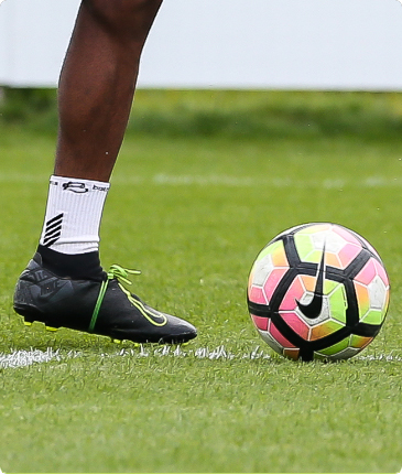 kicking a football 