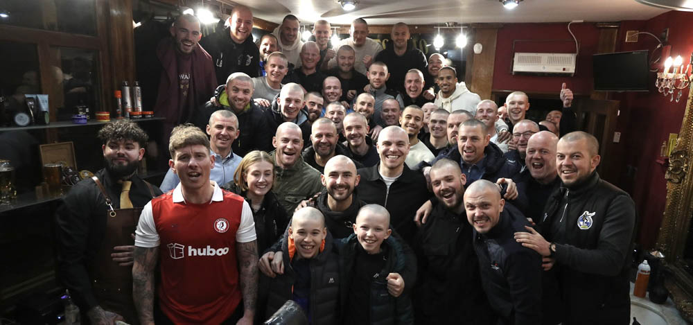 Bristol Rovers players and staff shave their heads in support of teammate Nick Anderton