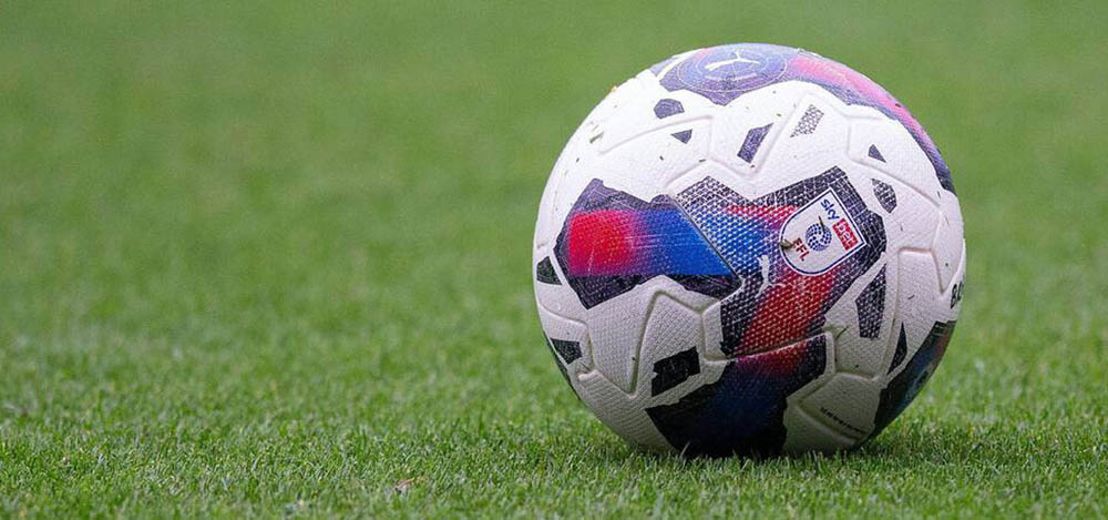 Football on a grass pitch