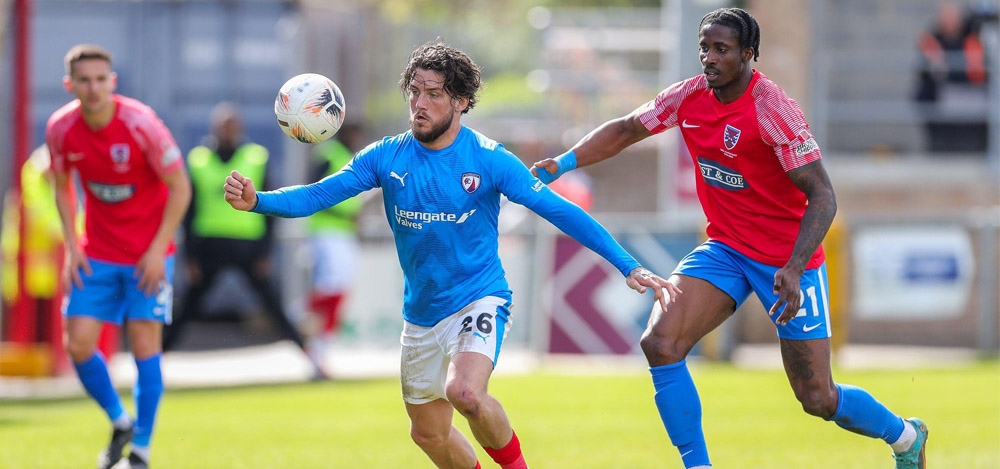 Chesterfield midfielder Darren Oldaker (26) Dagenham & Redbridge defender David Longe-King (21) during the Dagenham & Redbridge v Chesterfield National League match