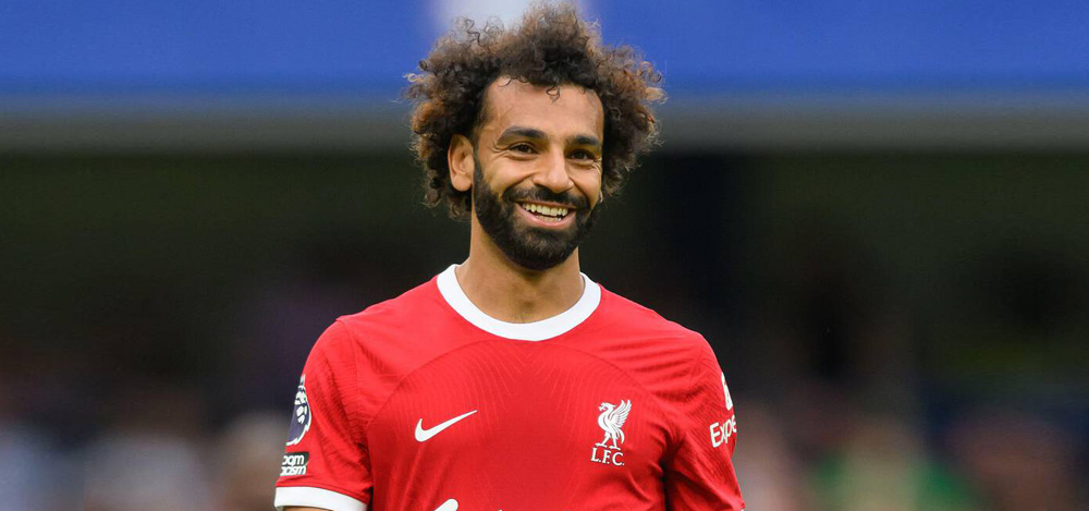 Mohamed Salah, wearing a red Liverpool shirt